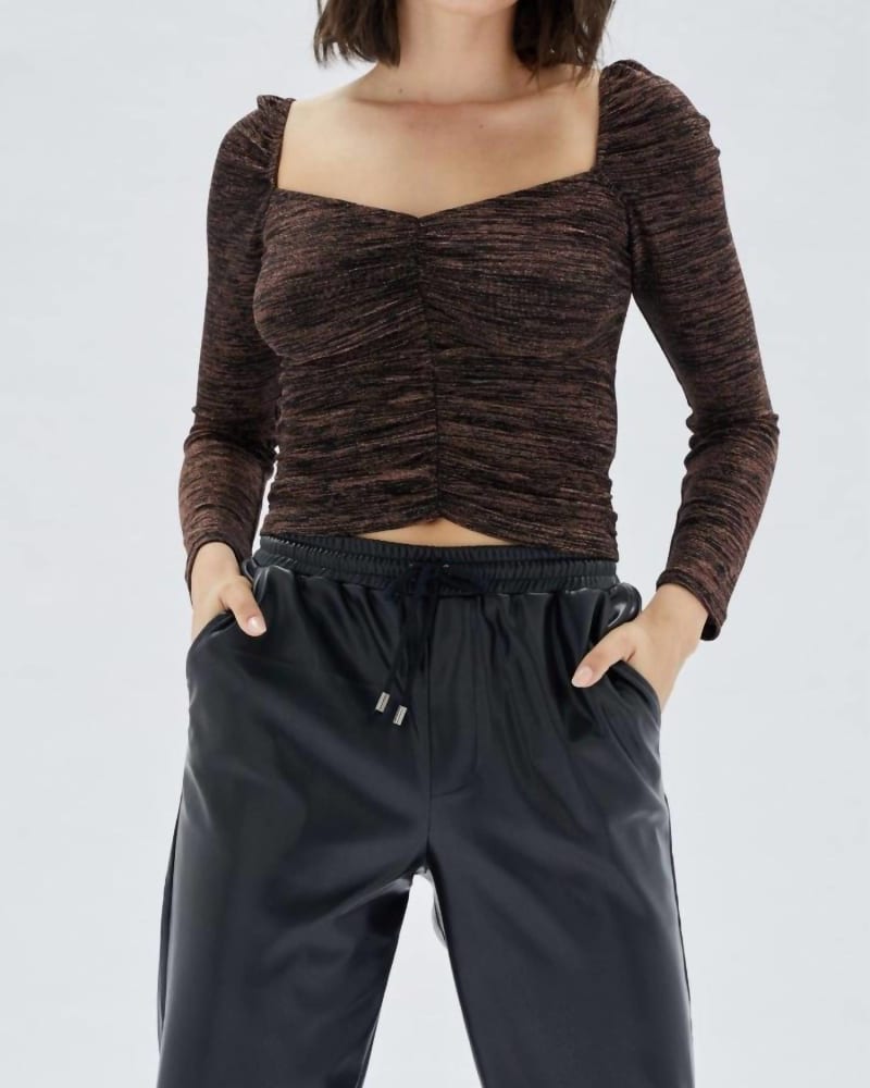 Front of a model wearing a size L Imane Ruched Top in Black/Bronze in Black/Bronze by MINKPINK. | dia_product_style_image_id:345878